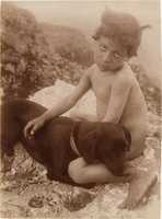 Free download [Nude Young Child with Dog in Lap, Sicily, Italy] free photo or picture to be edited with GIMP online image editor